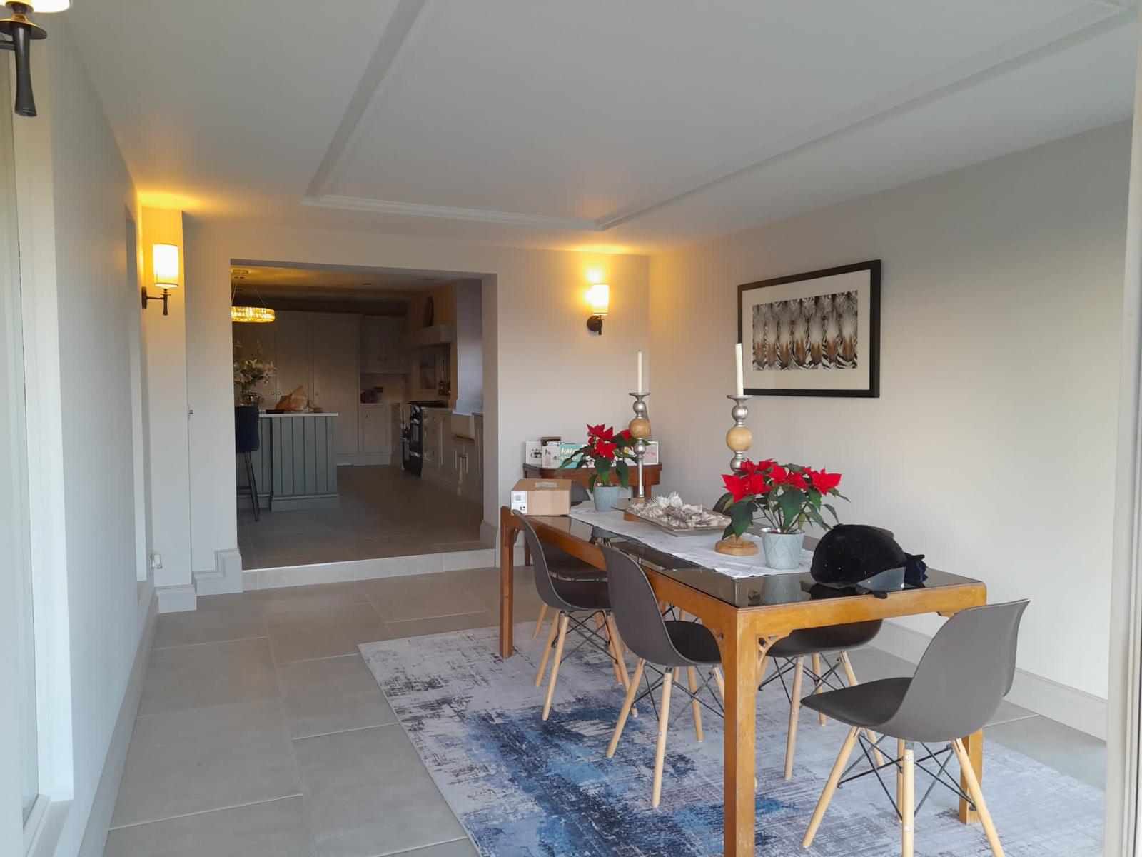 renovated dining room with kitchen in the back