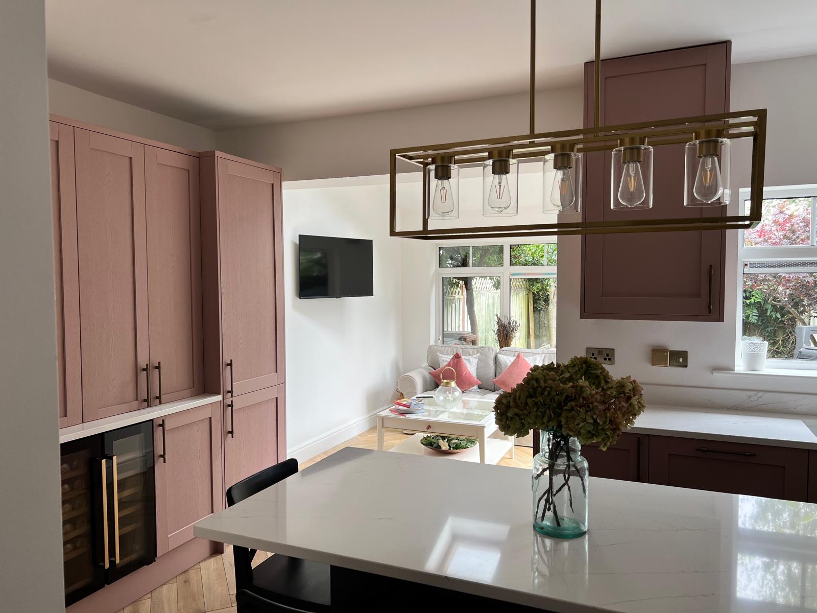 renovated pink kitchen with island