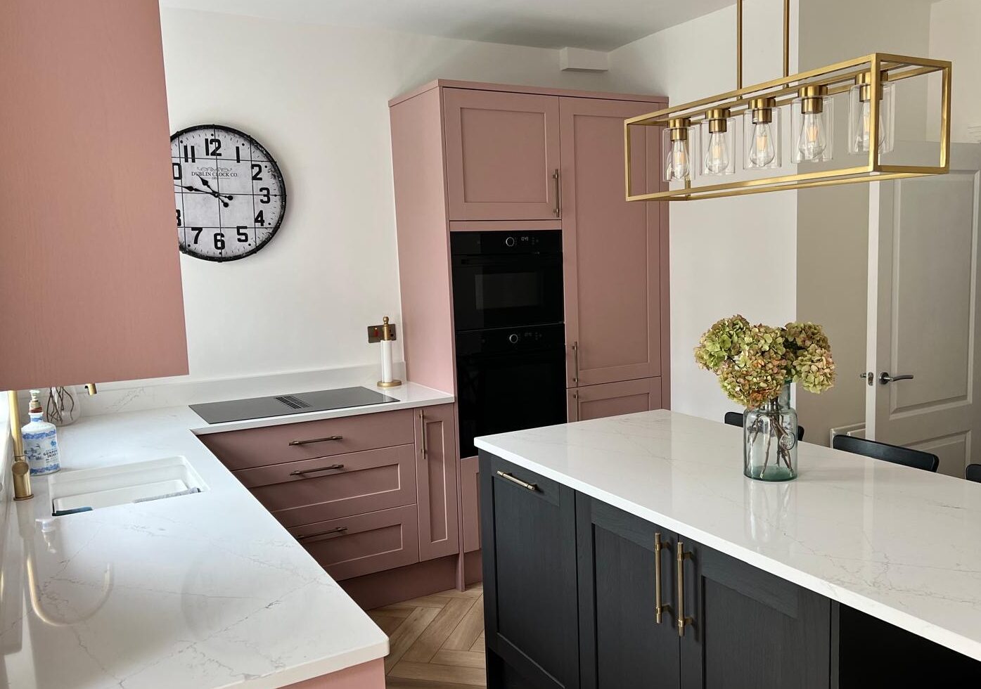 renovated pink kitchen with island