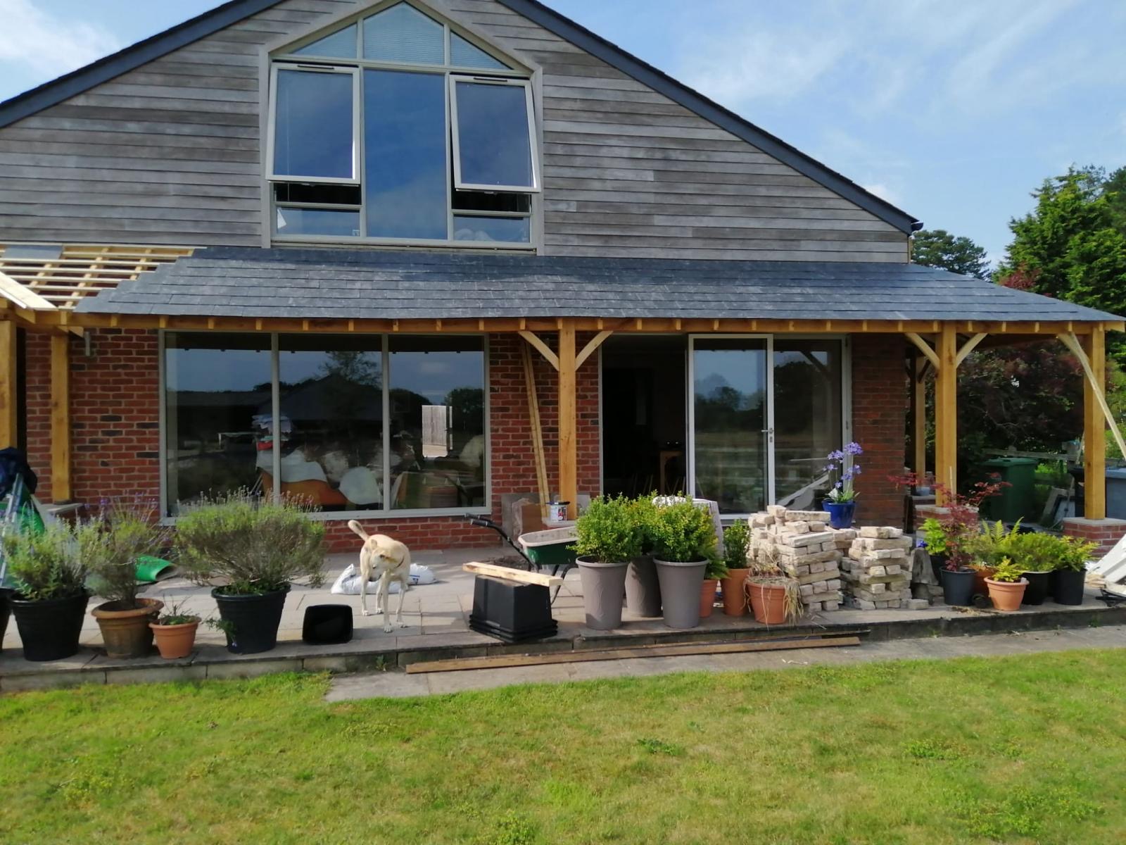 completed outisde of the house including new porch and canopy